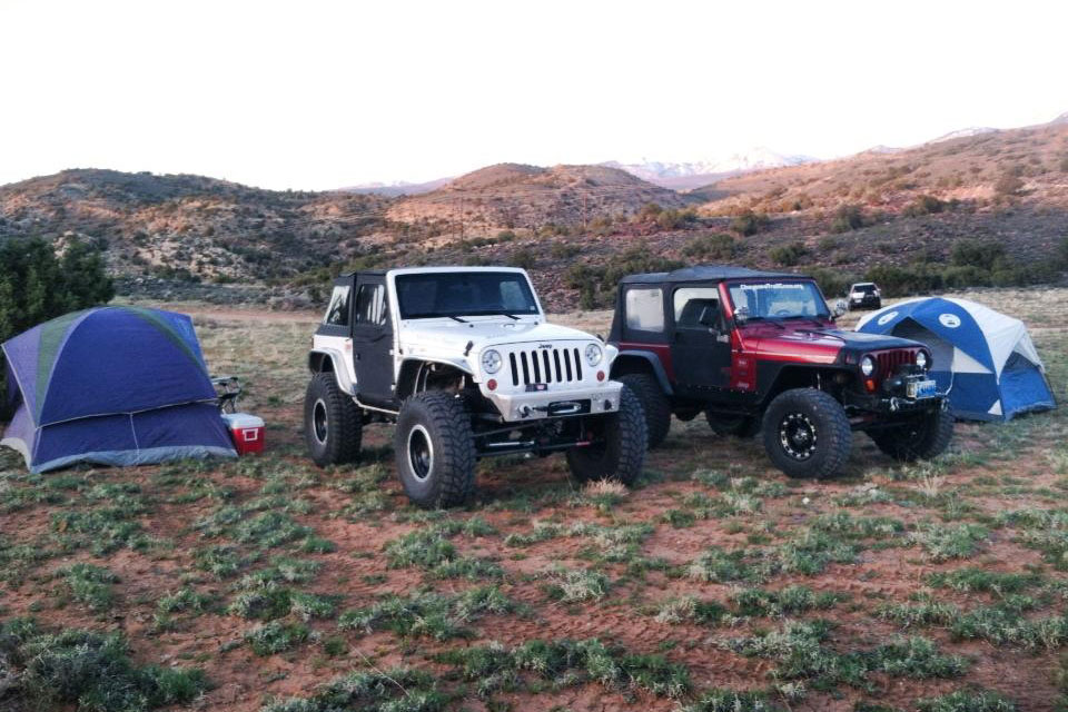 Jeeps by ground tents