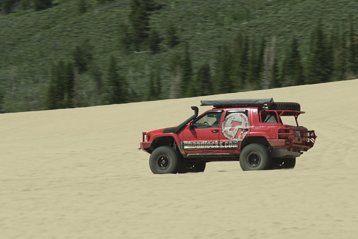 Red 4x4 in the sand