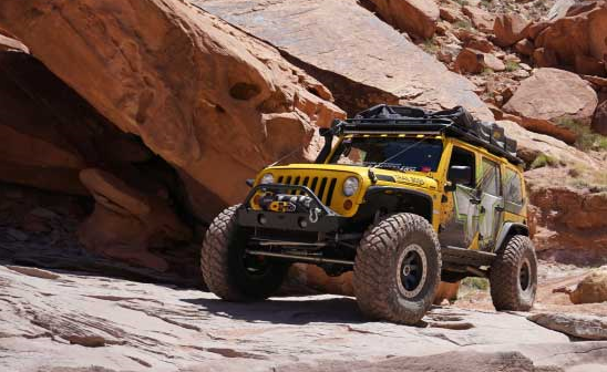 Yellow Jeep in the rocks