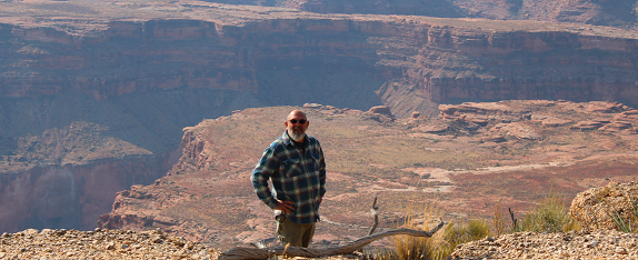 Bob Levenhagen standing at the edge of the North rim of the Grand Canyon